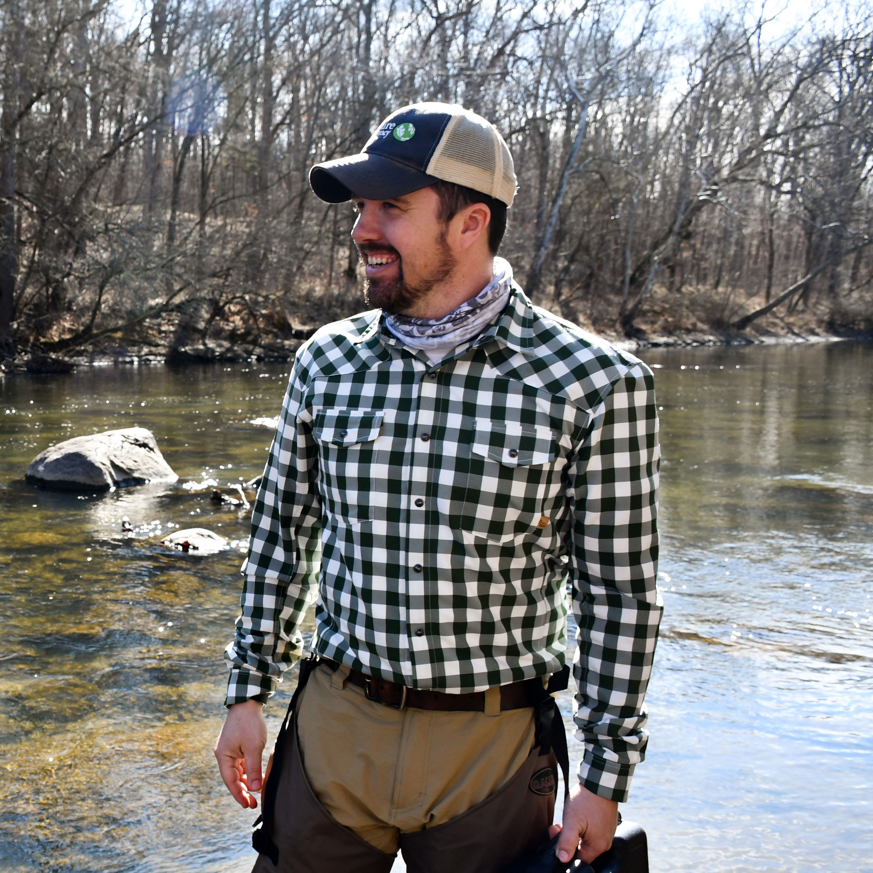 TNC's Seth Harden standing in Wabash River.