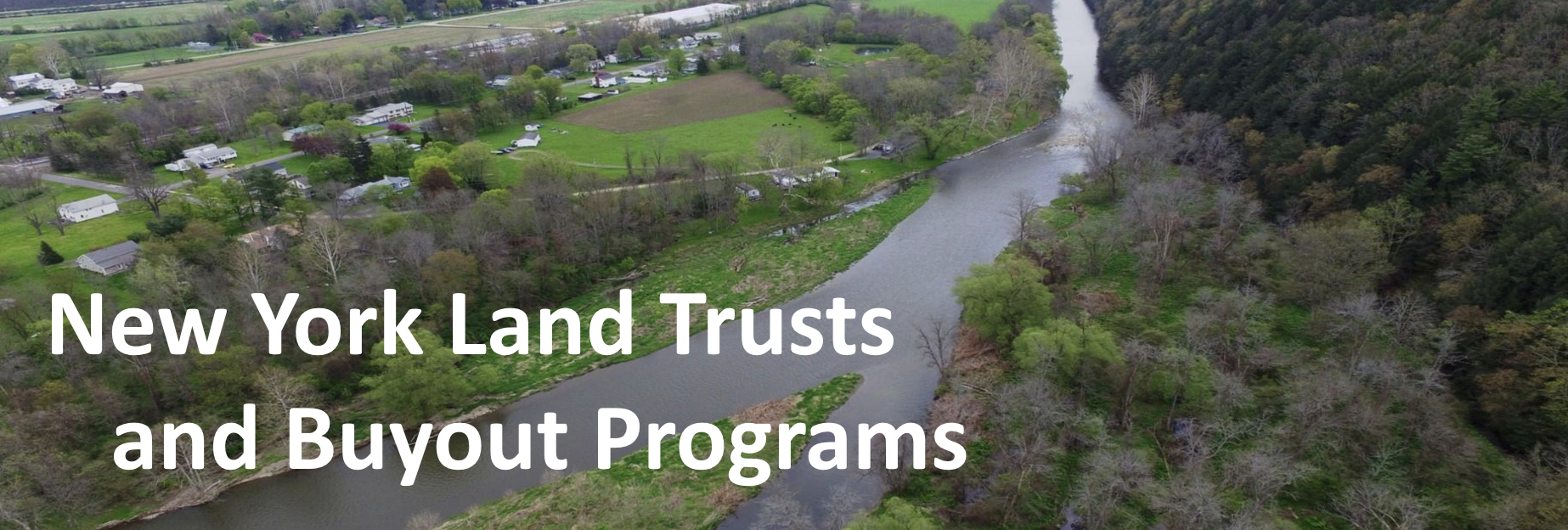 Aerial view of town with words on top saying "New York Land Trusts and Buyouts."