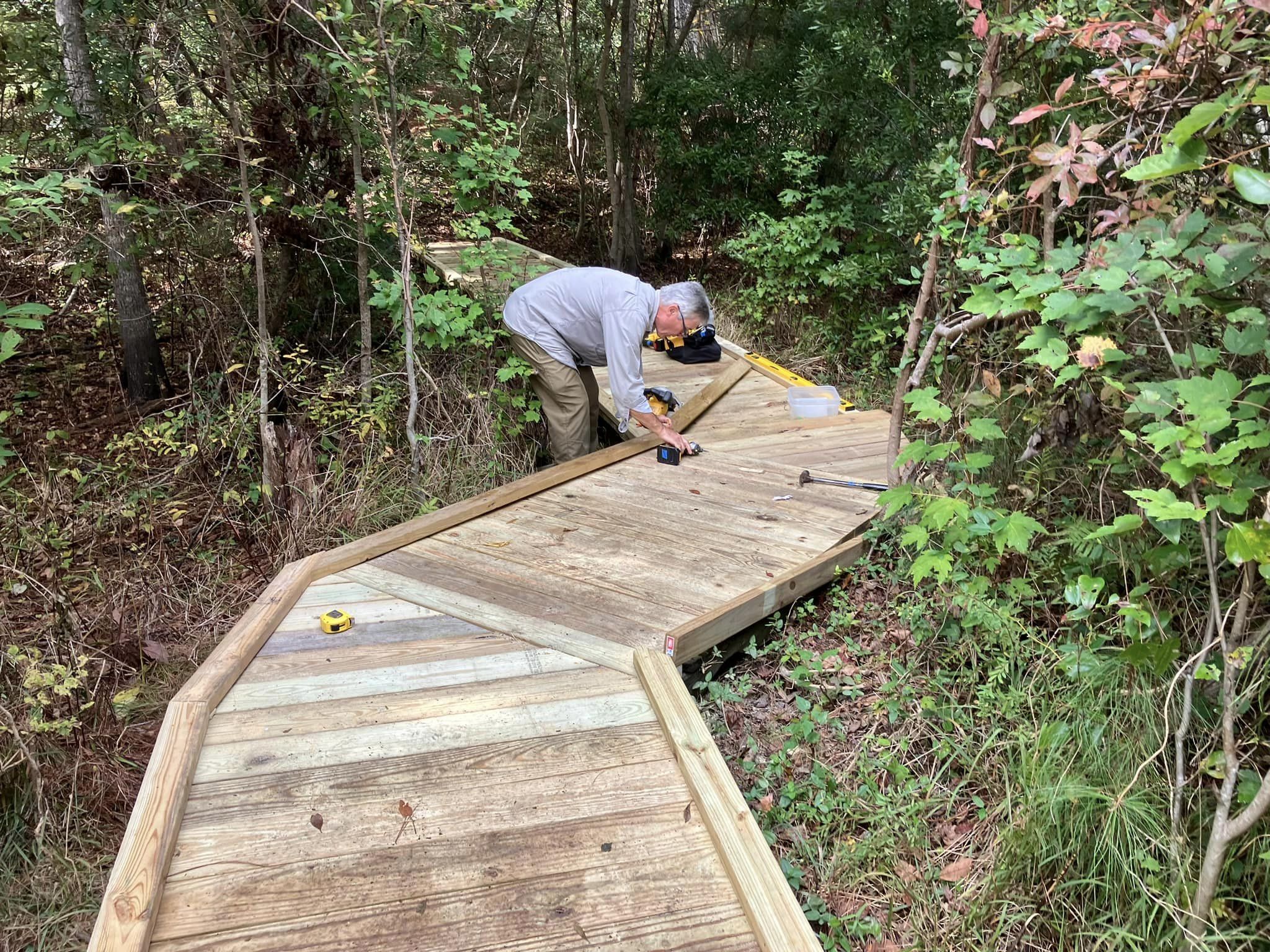 TNC volunteer building ADA trail.