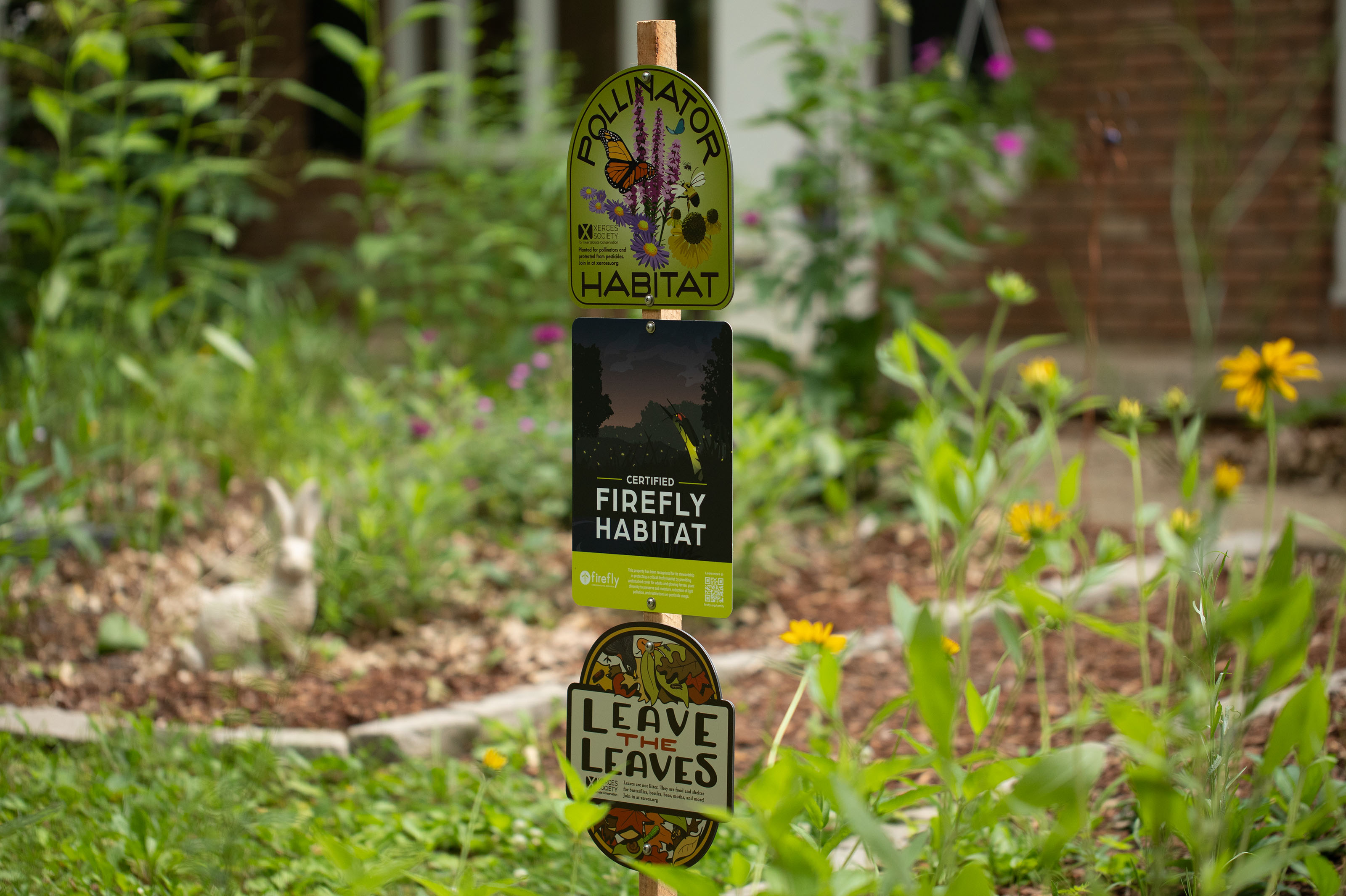 Wildlife habitat sign installed in native plant garden.