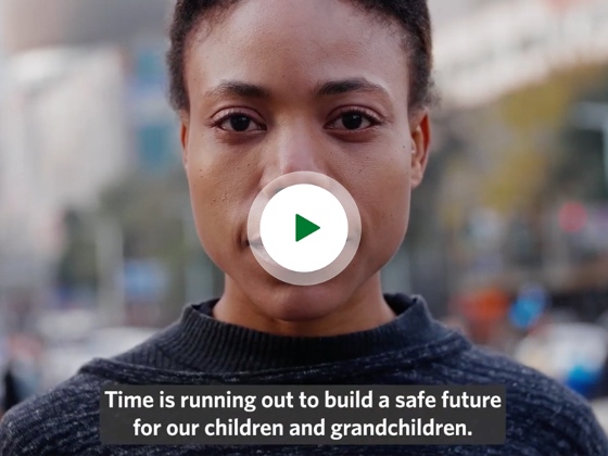  Video thumbnail of a person centered looking straight at the camera with the video captions reading 'Time is running out to build a safe future for our children and grandchildren.'