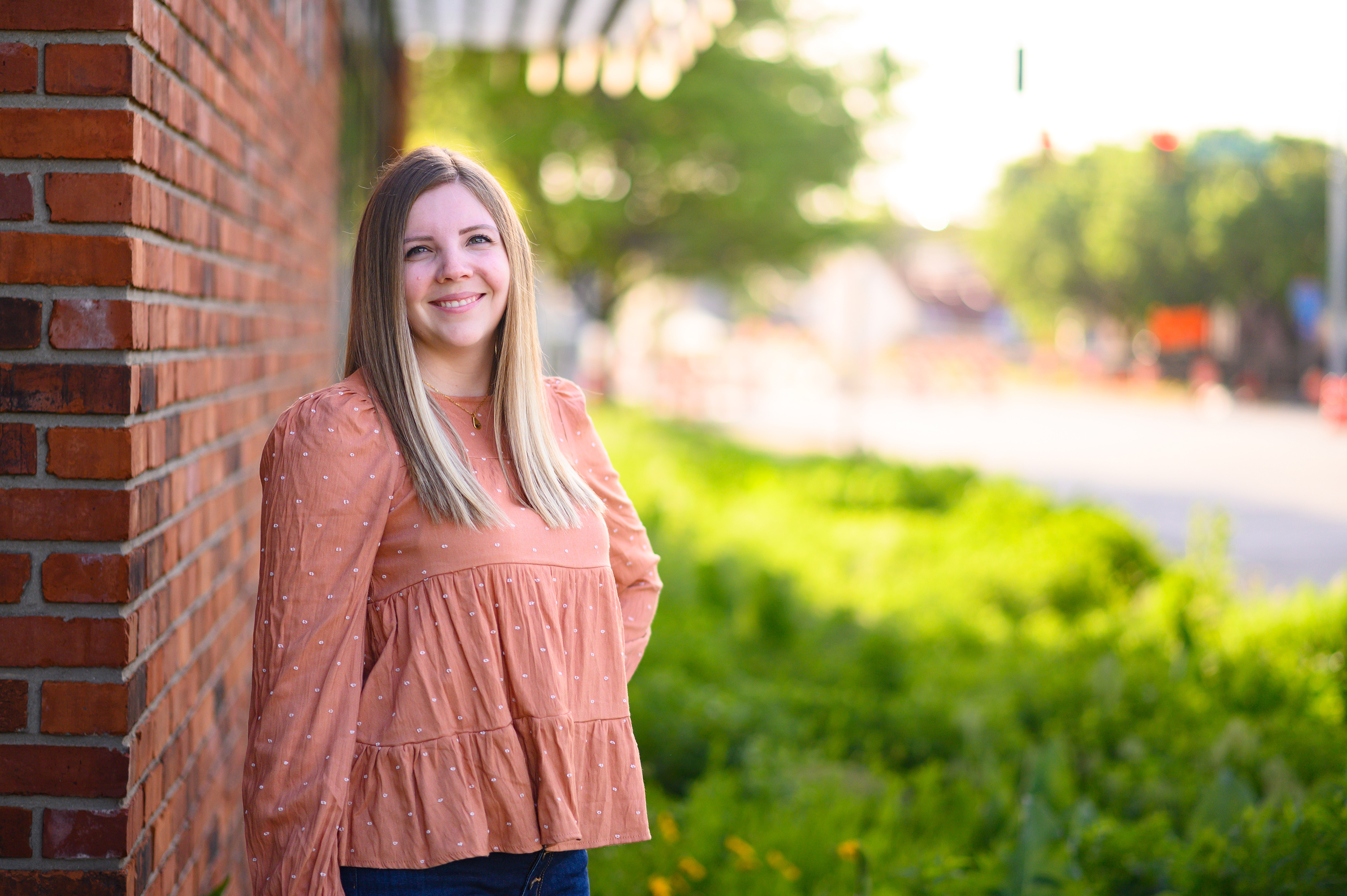 TNC's Sarah Reilly standing next to office building.