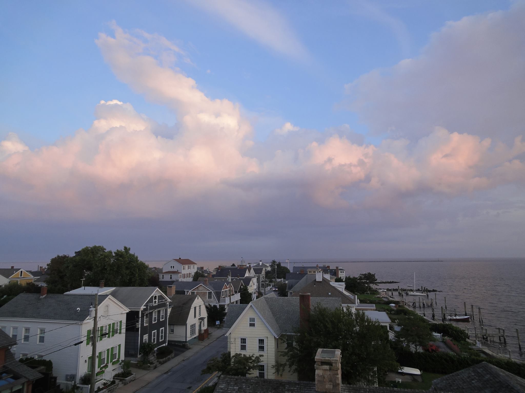 Muted sunlight shines on a coastal town.