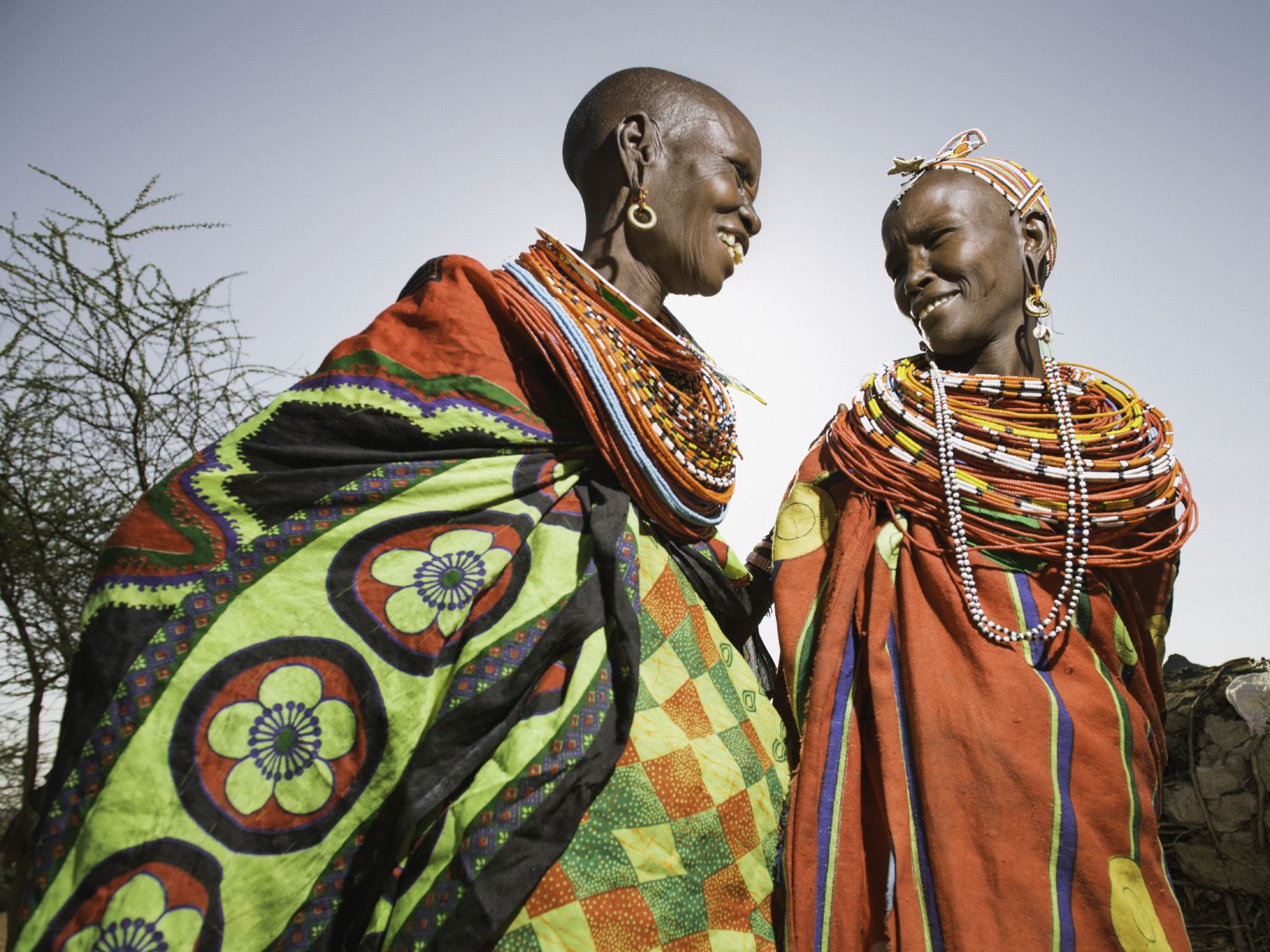 Two Samburu women laughing together.