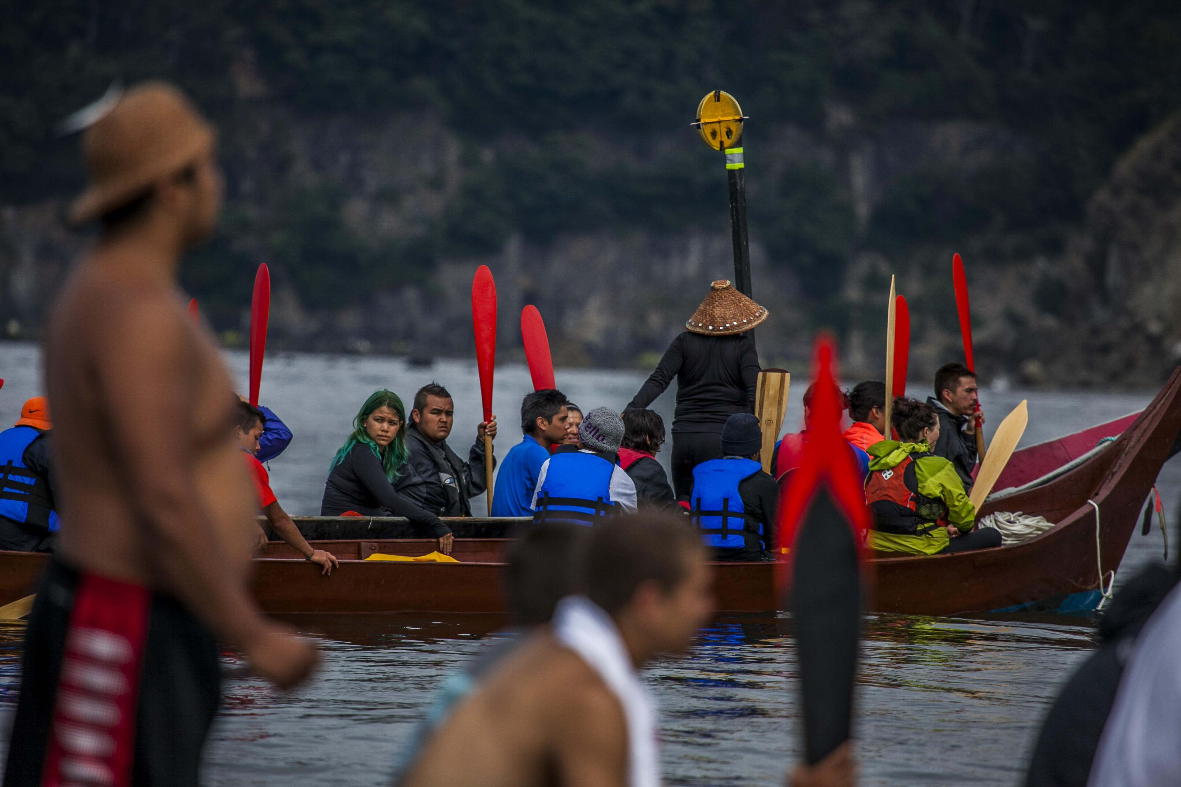 Families from around the Pacific Northwest gather in canoes to travel to Point Grenville on the Quinalt Reservation.